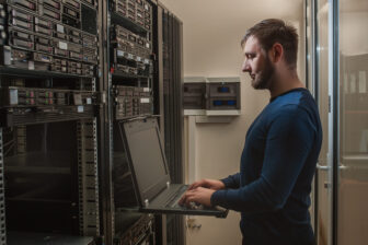 network engineer working in server room